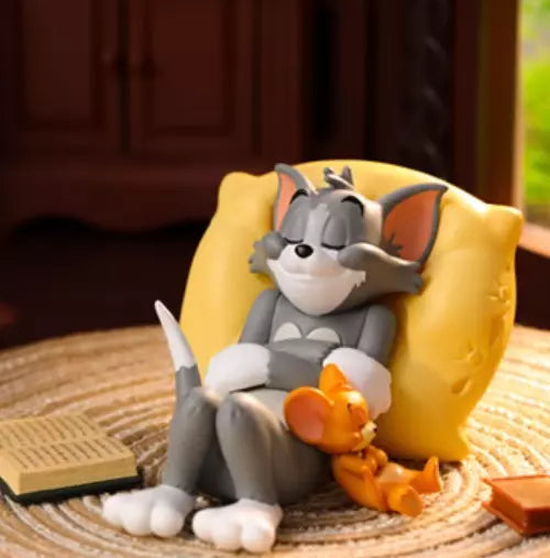 Tom sleeping on a cheese pillow while Jerry cuddles next to him from Tom & Jerry Best Friend's Day blind box series