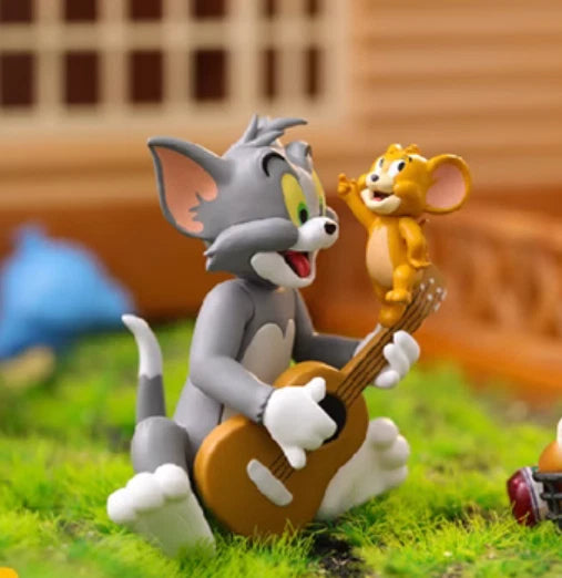 Tom playing guitar while Jerry dances on top in Best Friend's Day blind box collectible