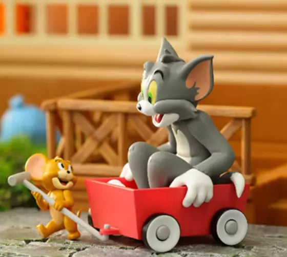Tom & Jerry collectible figure of Jerry pulling Tom in a red wagon from Best Friend's Day blind box series