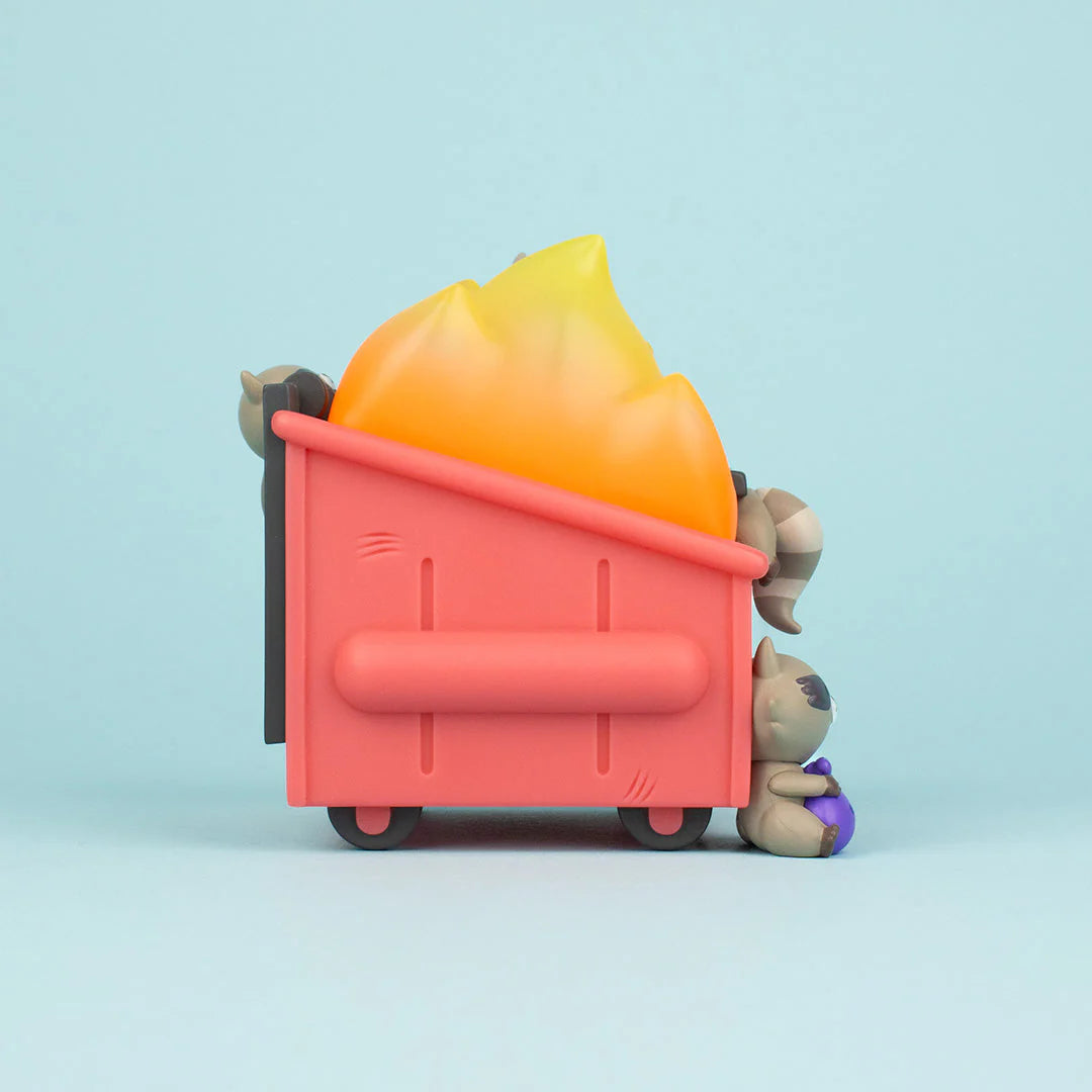 Trash Panda Dumpster Fire vinyl figure left side view with raccoon holding a purple trash bag
