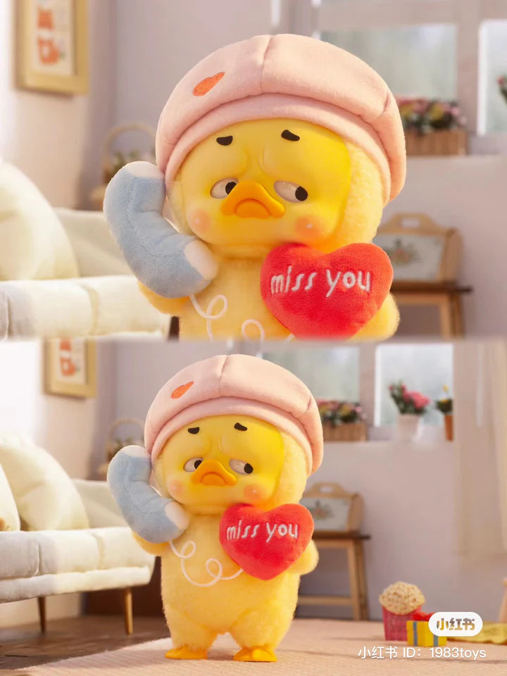 Upset Duck phone edition holding plush heart and telephone