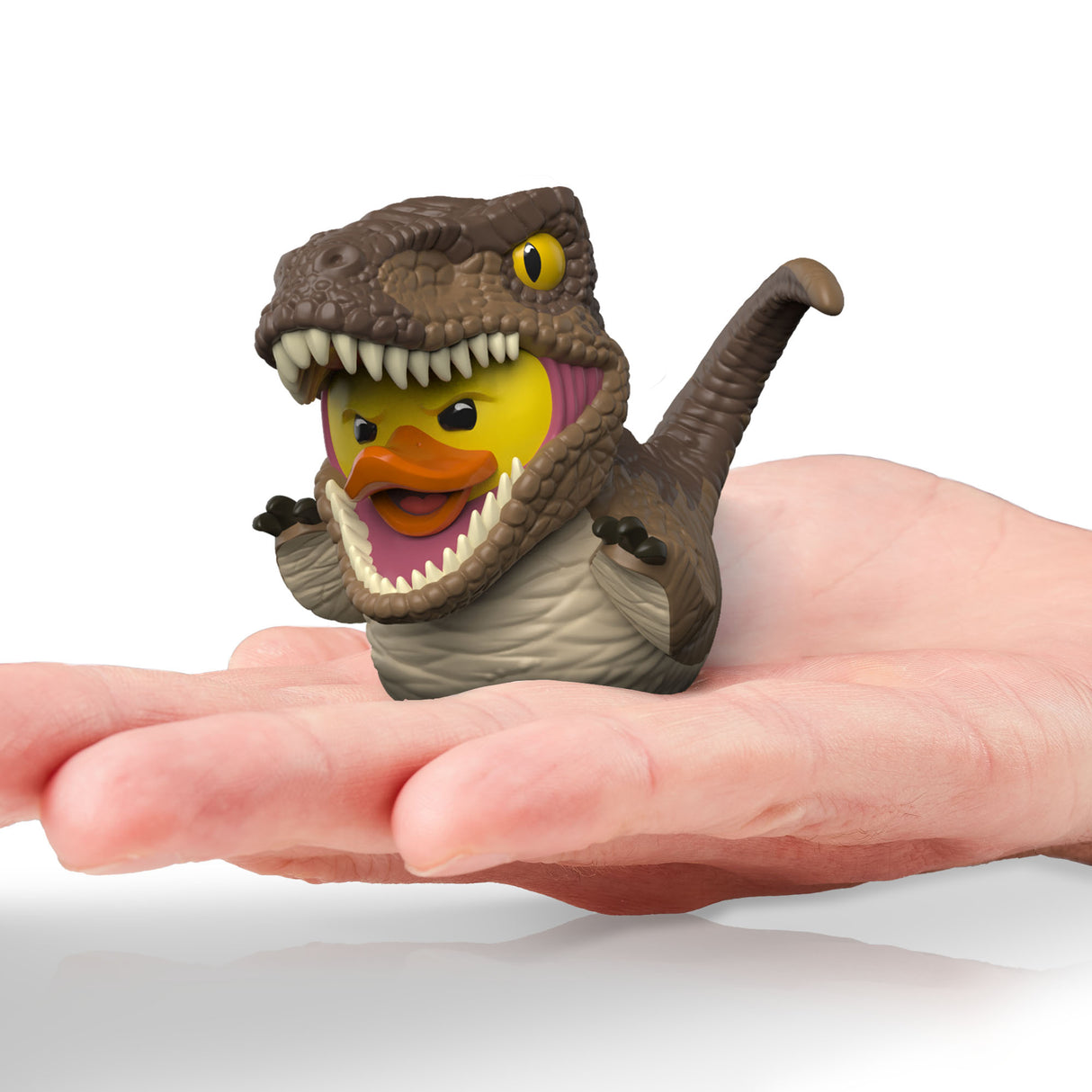 Velociraptor Mini TUBBZ displayed in the palm of a hand