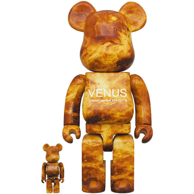 Front view of NASA Venus Bearbrick set showing fiery planetary design and white mission text
