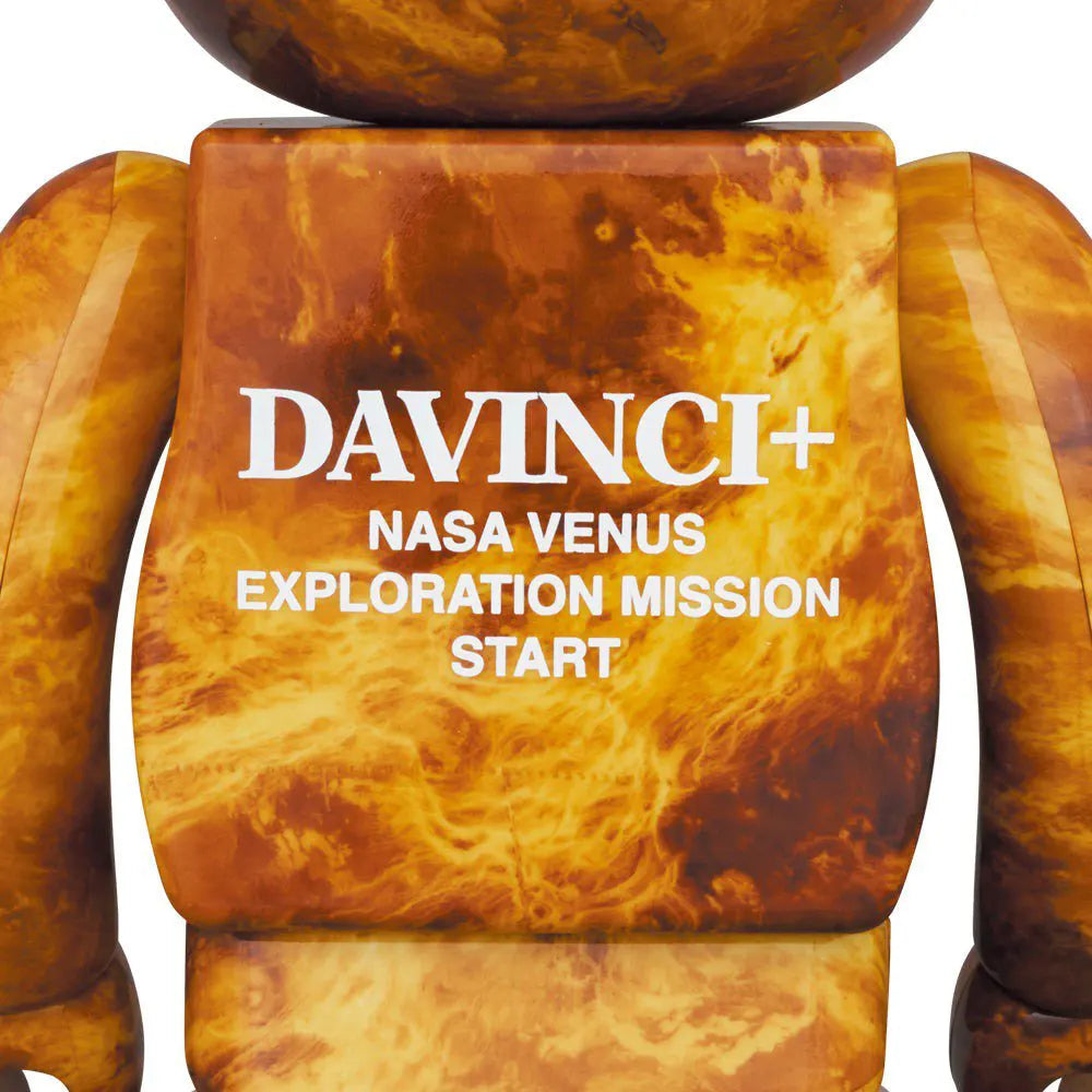 Rear view of Bearbrick Venus figure showing “DAVINCI+ NASA VENUS EXPLORATION MISSION START” print