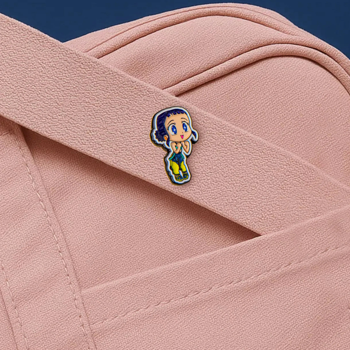 Zoey pin attached to pink fabric outfit