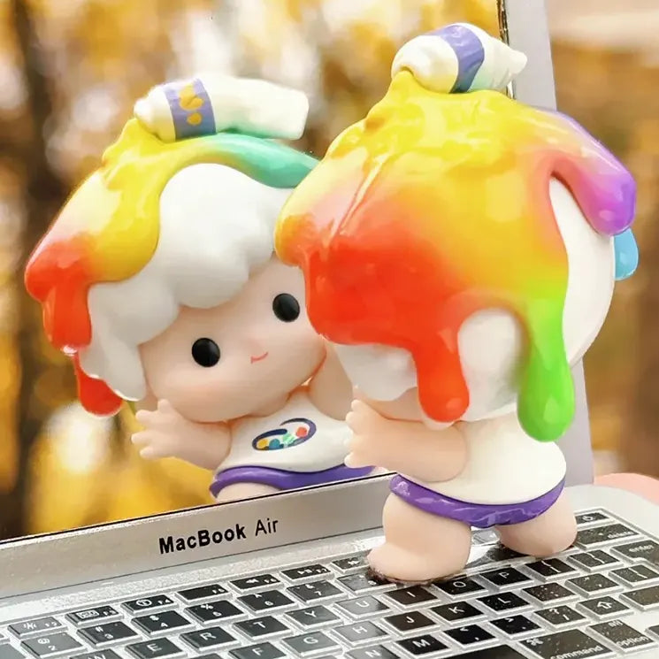 Back view of Zozo rainbow paint blind box figure showing dripping rainbow effect