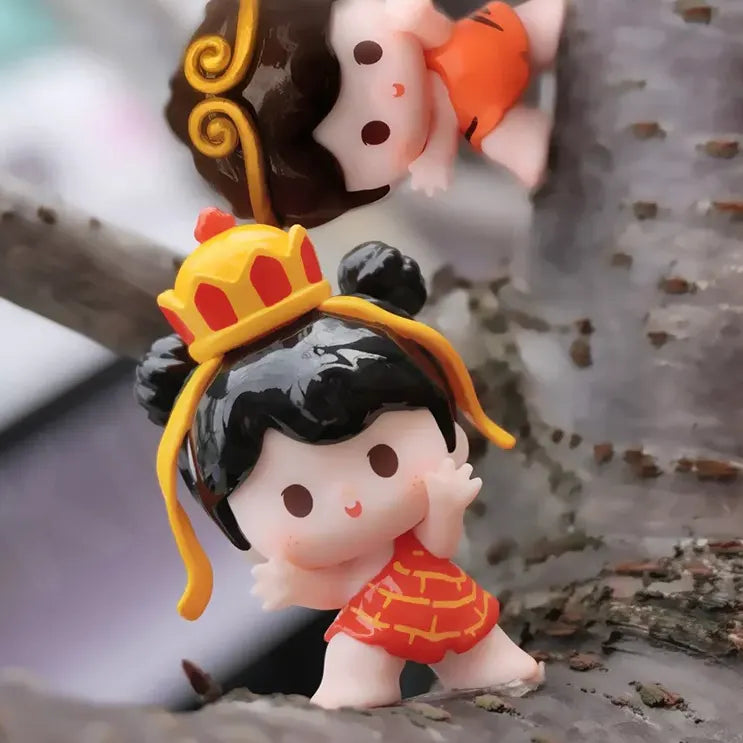 Yoyo figure wearing a golden crown and red outfit from Lucky Double Treasure Blind Box