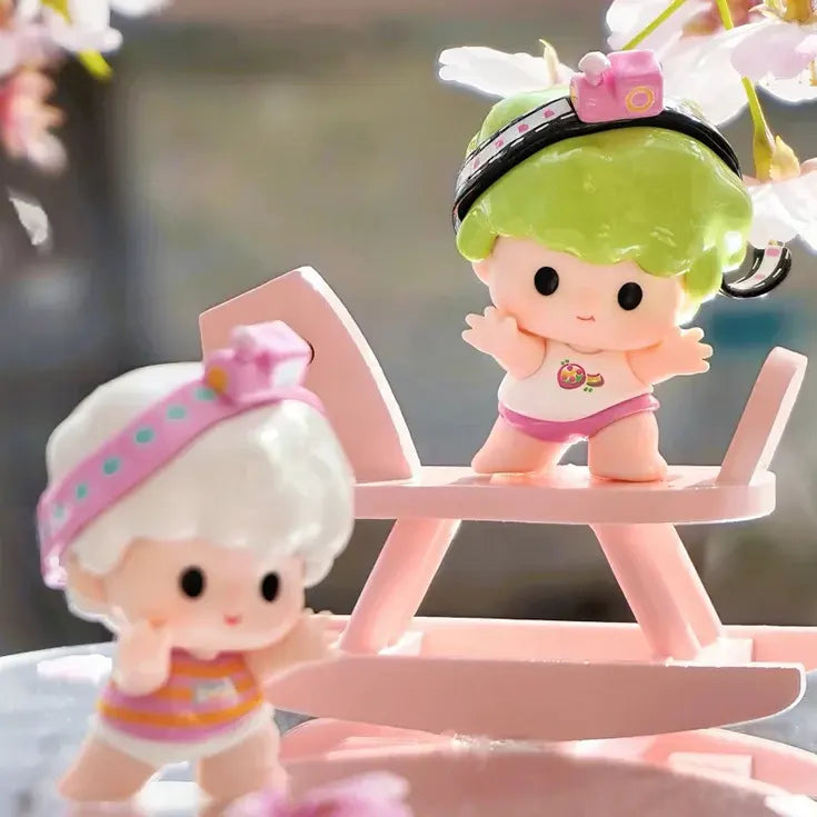 Yoyo vinyl figure with green hair standing on a pink rocker from Lucky Double Treasure Blind Box