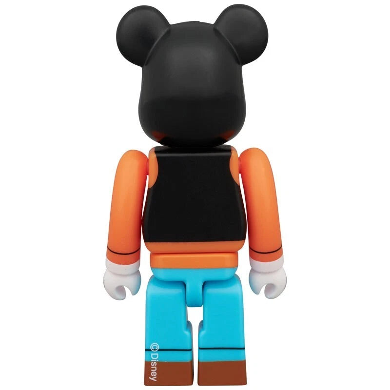 Back view of Bearbrick figure styled as Disney's Goofy with orange shirt, blue pants, and black vest.
