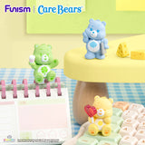 Care Bears Little Things Cubby Face Series figures posing with everyday accessories on a keyboard and desk