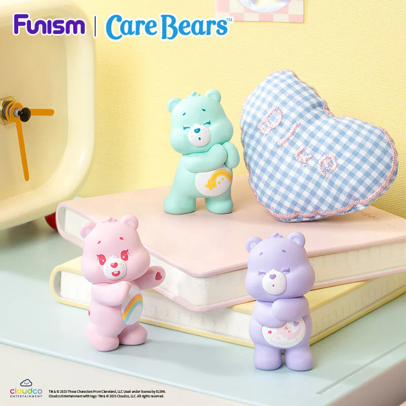 Wish Bear, Cheer Bear and Share Bear figures from the Care Bears Little Things Cubby Face Series