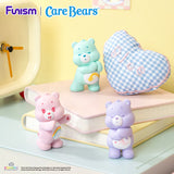 Wish Bear, Cheer Bear and Share Bear figures from the Care Bears Little Things Cubby Face Series
