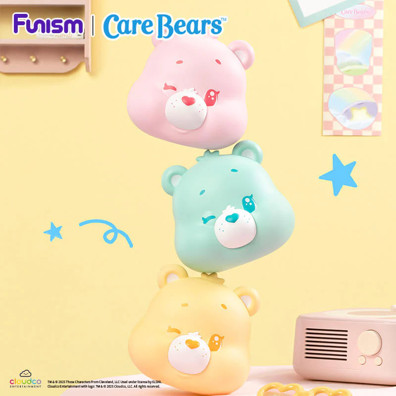Large pastel Care Bears Cubby Face accessories stacked together with mini Care Bears figures