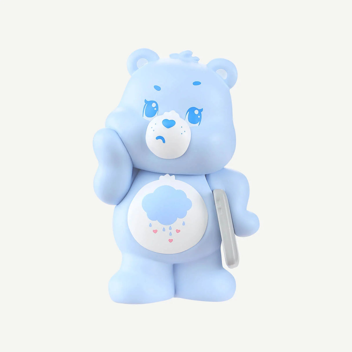 Close-up of the special Grumpy Bear figure from the Care Bears Little Things Cubby Face Series