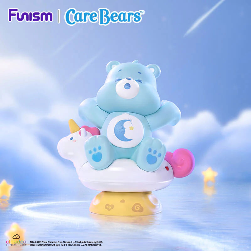 Bedtime Bear from the Care Bears Planet of Joy Series relaxing on a unicorn cloud beneath a dreamy night sky
