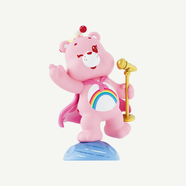 Close-up of Cheer Bear from the Care Bears Planet of Joy Series with rainbow belly badge and microphone