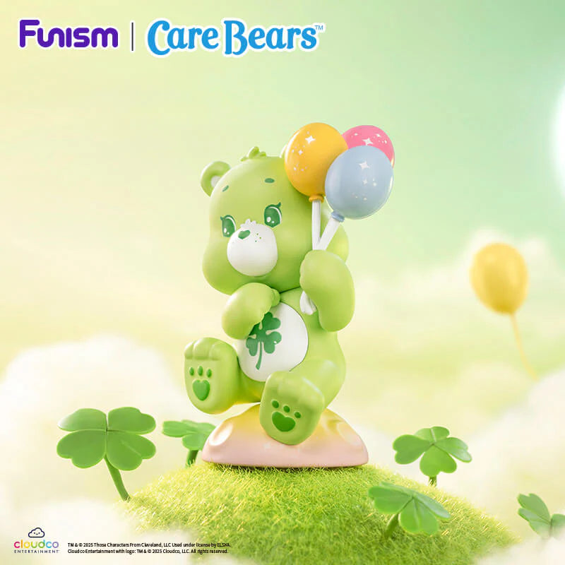 Good Luck Bear from the Care Bears Planet of Joy Series holding colorful balloons among lucky clovers