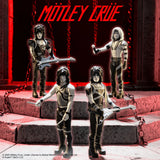 Mick Mars figure and detachable guitar accessory shown separately in grayscale finish
