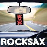 AC DC air freshener hanging from rearview mirror in car interior