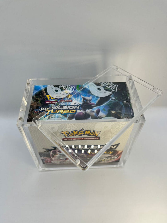 Acrylic display case with magnetic lid showcasing sealed Pokémon booster pack inside.