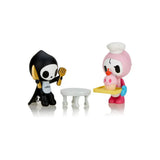 Bone Appetit vinyl figure with Ciao Ciao serving a skull cupcake to hungry Adios