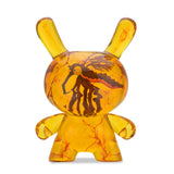 Front view of Amber Dunny 8 inch translucent resin art figure with preserved insect design