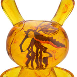 Close-up side detail of Amber Dunny resin figure with amber marbling effects