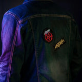 Anthrax pentagram and logo patches applied on the back of a denim jacket