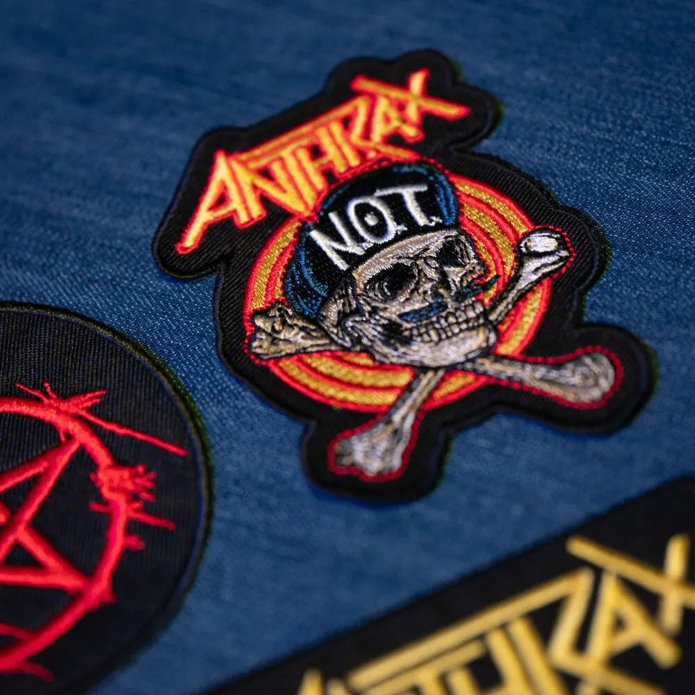 Close-up of Anthrax NOT! skull patch applied to denim