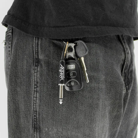 Anthrax plug keychain attached to keys in pocket