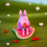 Blonks fruit bat figure sitting on watermelon holding strawberry