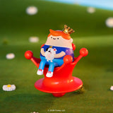 Blonks character sitting on red chair holding small pet