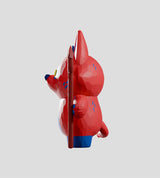 Side profile of Bubba Bad art toy showing sculpted shape and pitchfork