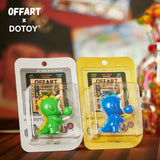 Green and blue Bubble Dino figures displayed together with arcade card packaging