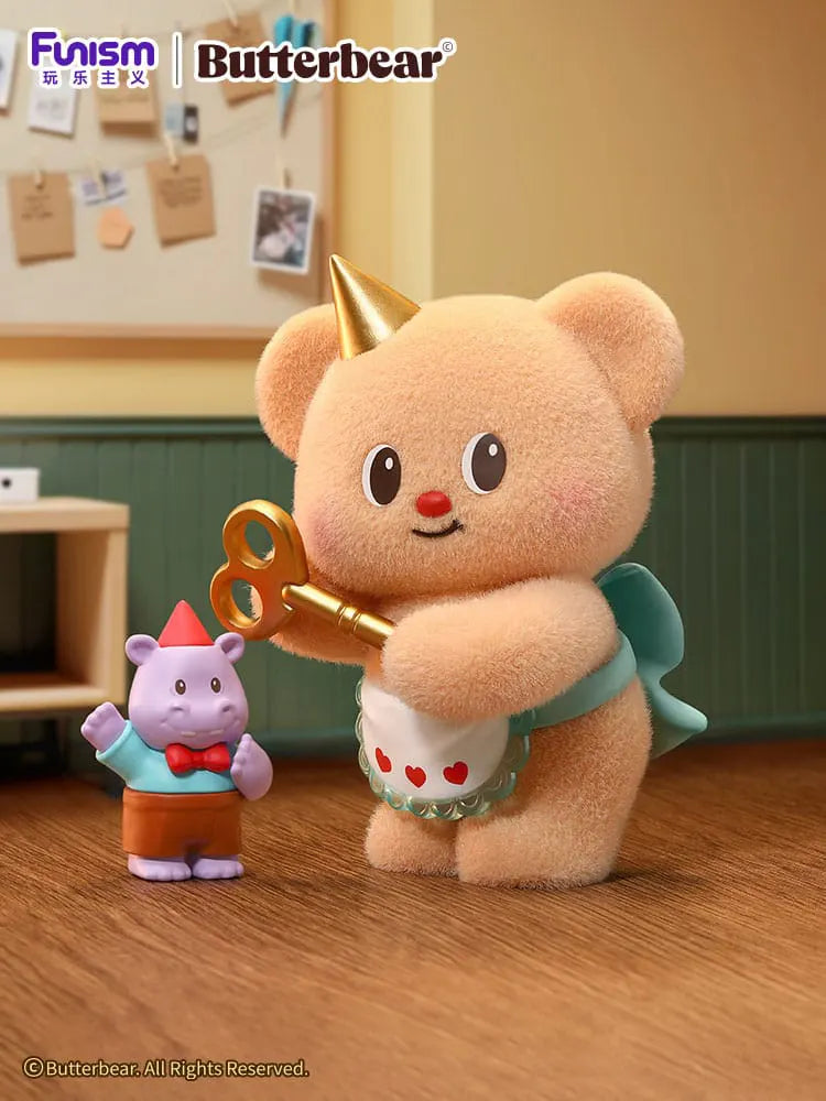 Butterbear Adorable Influencer Series party planner figure holding a large golden key beside a small party guest