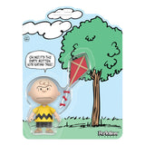 Charlie Brown Peanuts ReAction Figure with red kite accessory on die-cut comic panel cardback