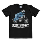 Black T-shirt featuring Cookie Monster riding a motorcycle with the text “Born To Be Hungry – Est. 1966” in bold white print.
