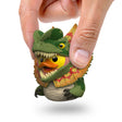 Hand holding Dilophosaurus Mini TUBBZ duck figure with frilled dinosaur design.