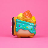 Close side view of donut-inspired Dumpster Fire figure