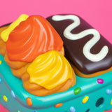 Close-up of cruller flame and frosting on Dumpster Fire vinyl figure