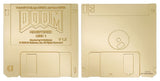 Front and back view of the gold Doom replica floppy disk collectible