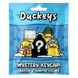 Duckeys Mystery Keycap blind bag packaging front for Season 2 Winter Escape.