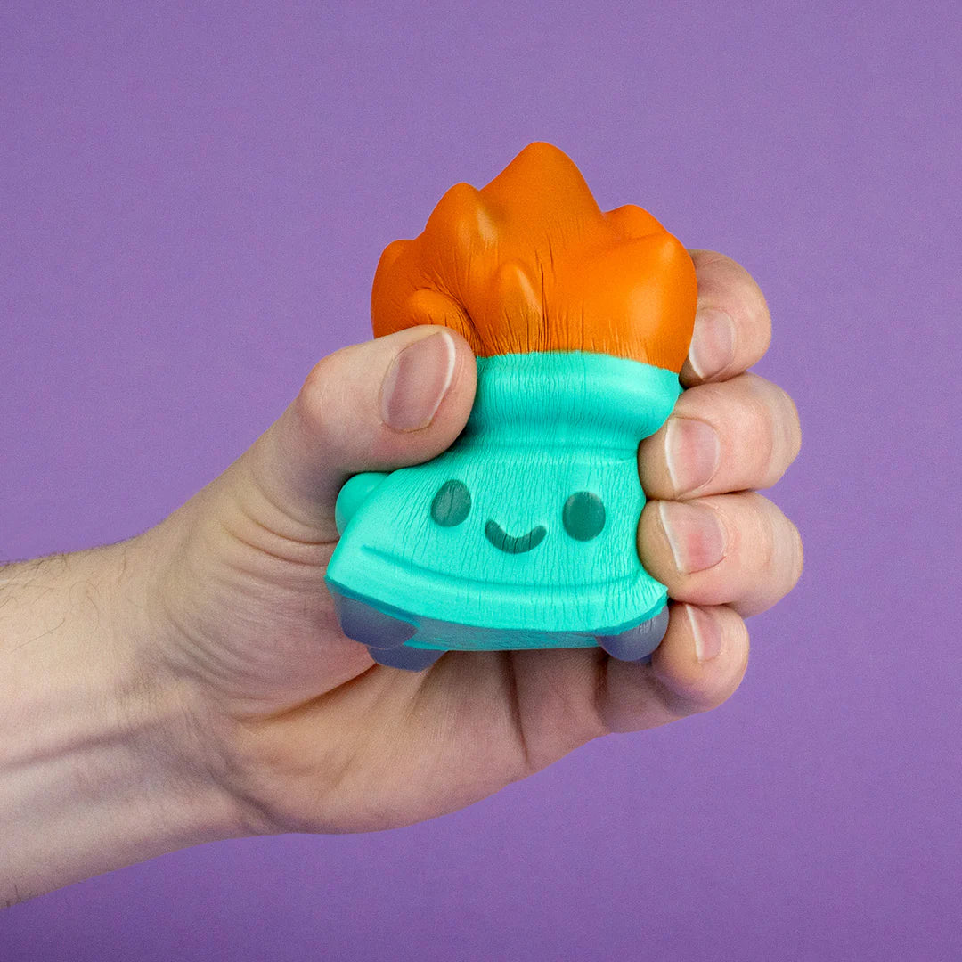 Close-up of Dumpster Fire stress squishy being squeezed from the side