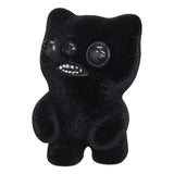 Black Fuggler motion-activated vinyl figure with sound and human-like teeth.