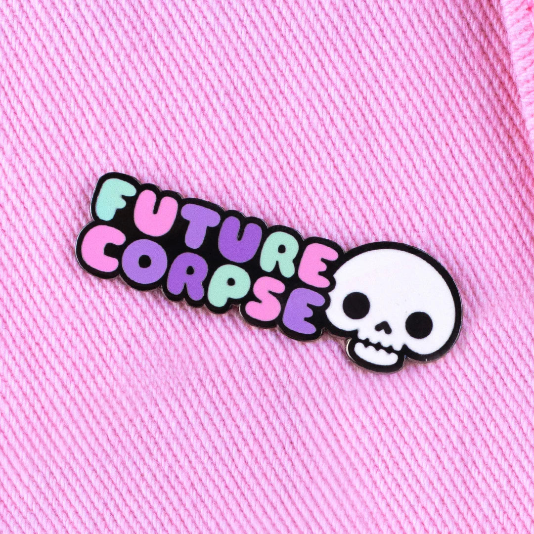 future corpse enamel pin attached to pink fabric aesthetic pin