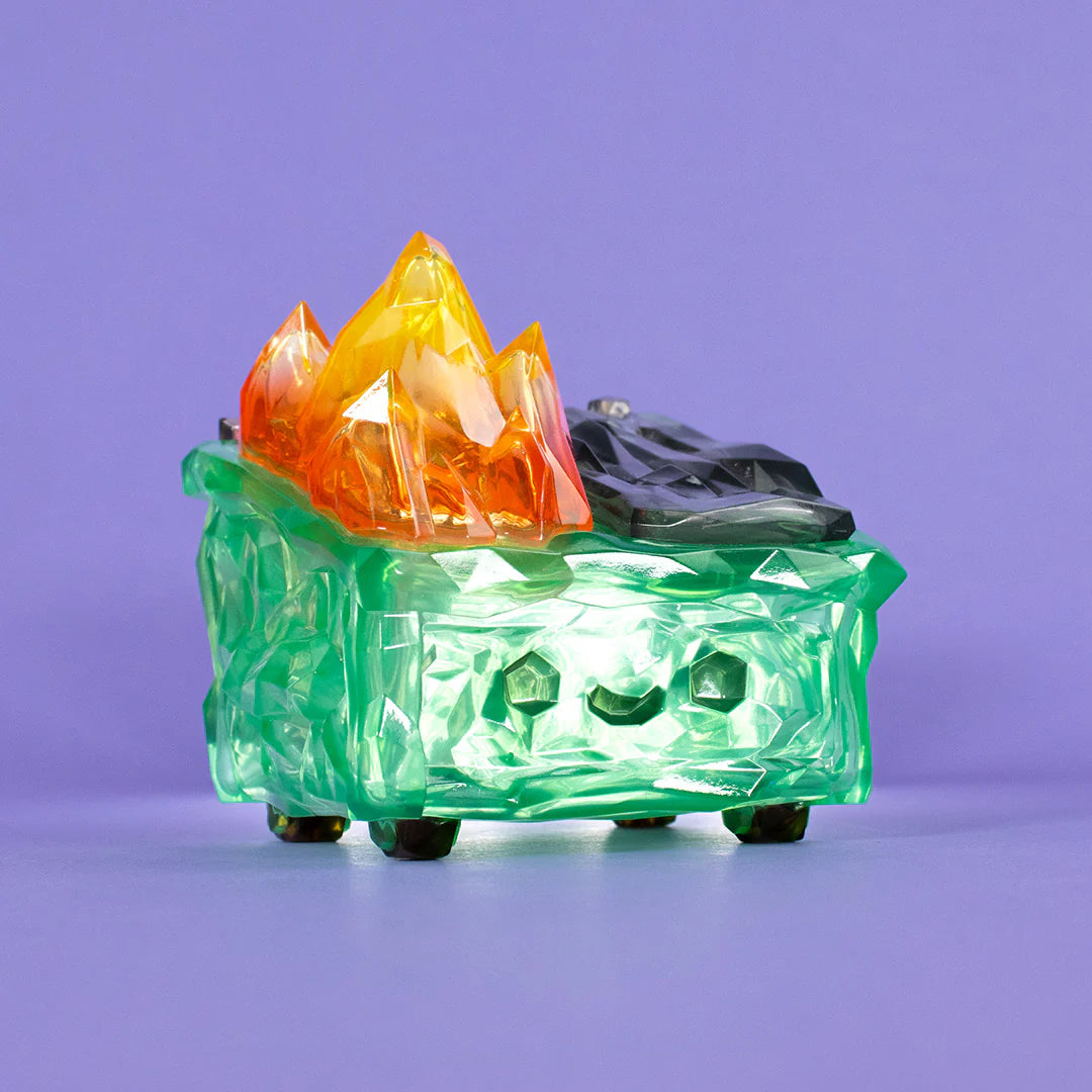 Gem Dumpster Fire vinyl figure from low angle emphasizing crystal textures