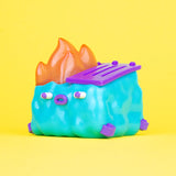 side view of 100% Soft GlanderCo dumpster fire vinyl collectible