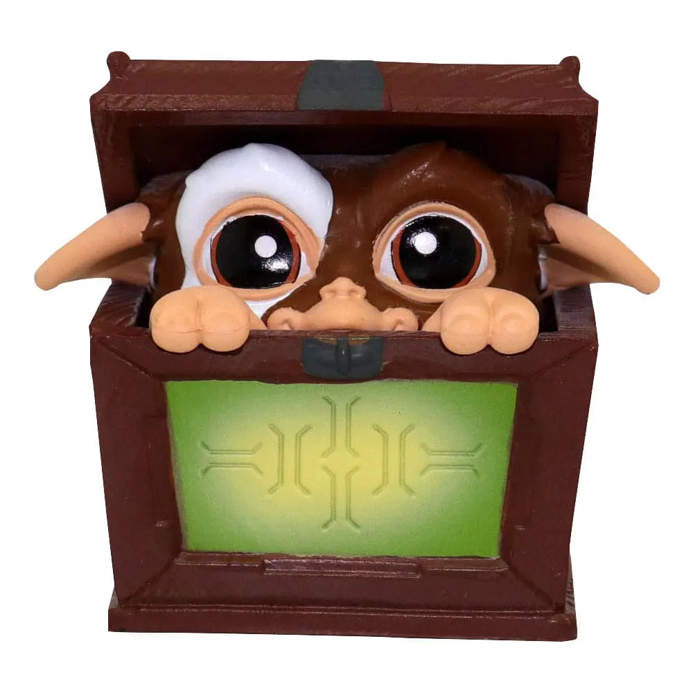 Gizmo peeking out of a wooden box mini figure from Gremlins Blind Box Wave 1.