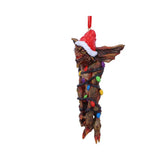Side view of Mohawk wrapped in colourful Christmas fairy lights