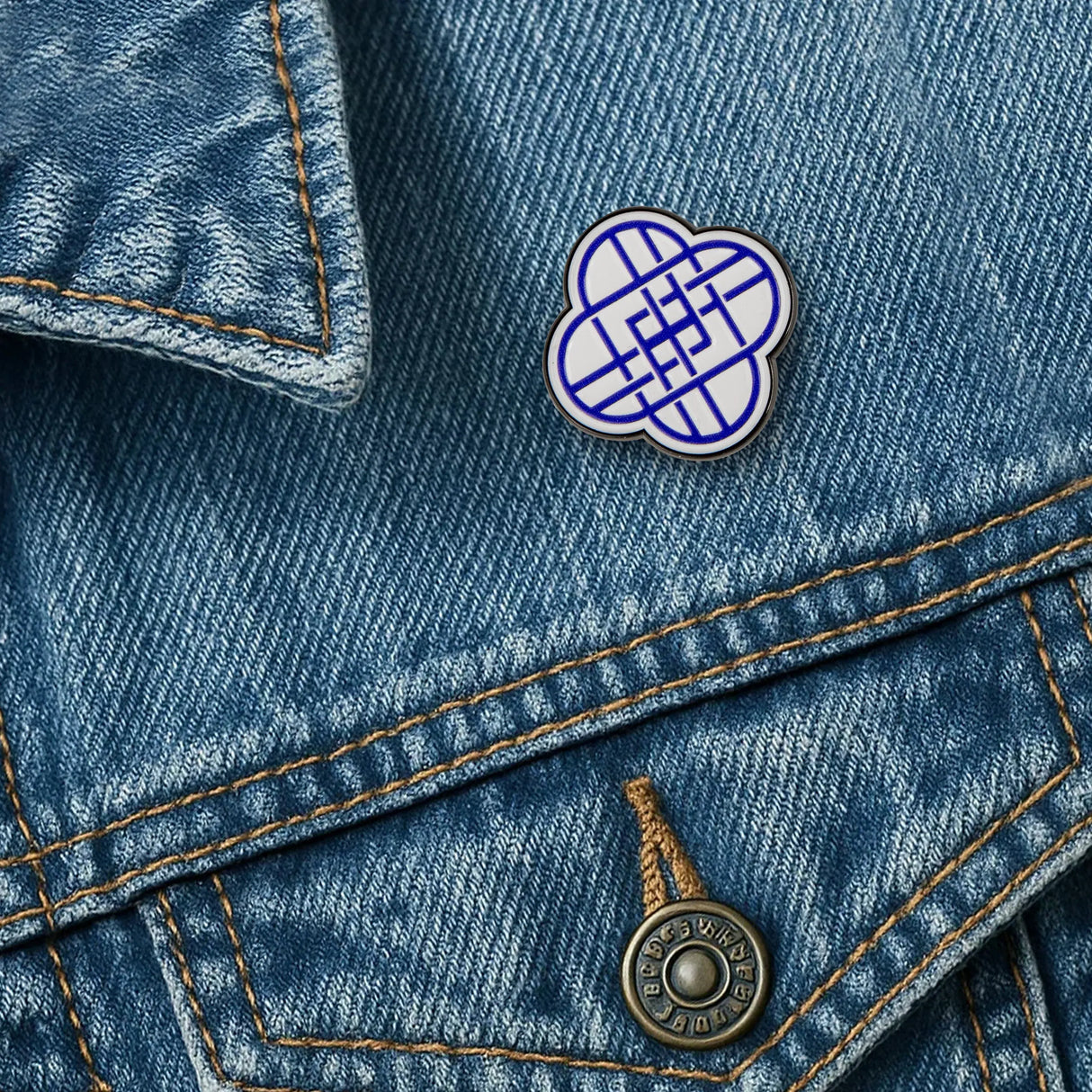 HUNTRIX logo pin attached to denim jacket